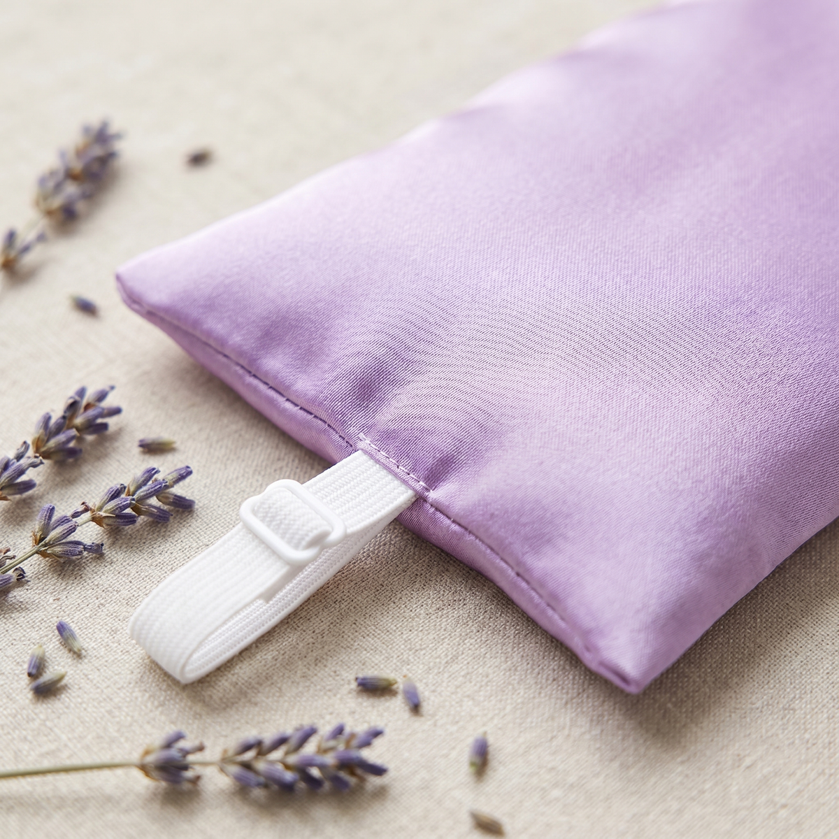 Close-up of the satin eye pillow with lavender buds