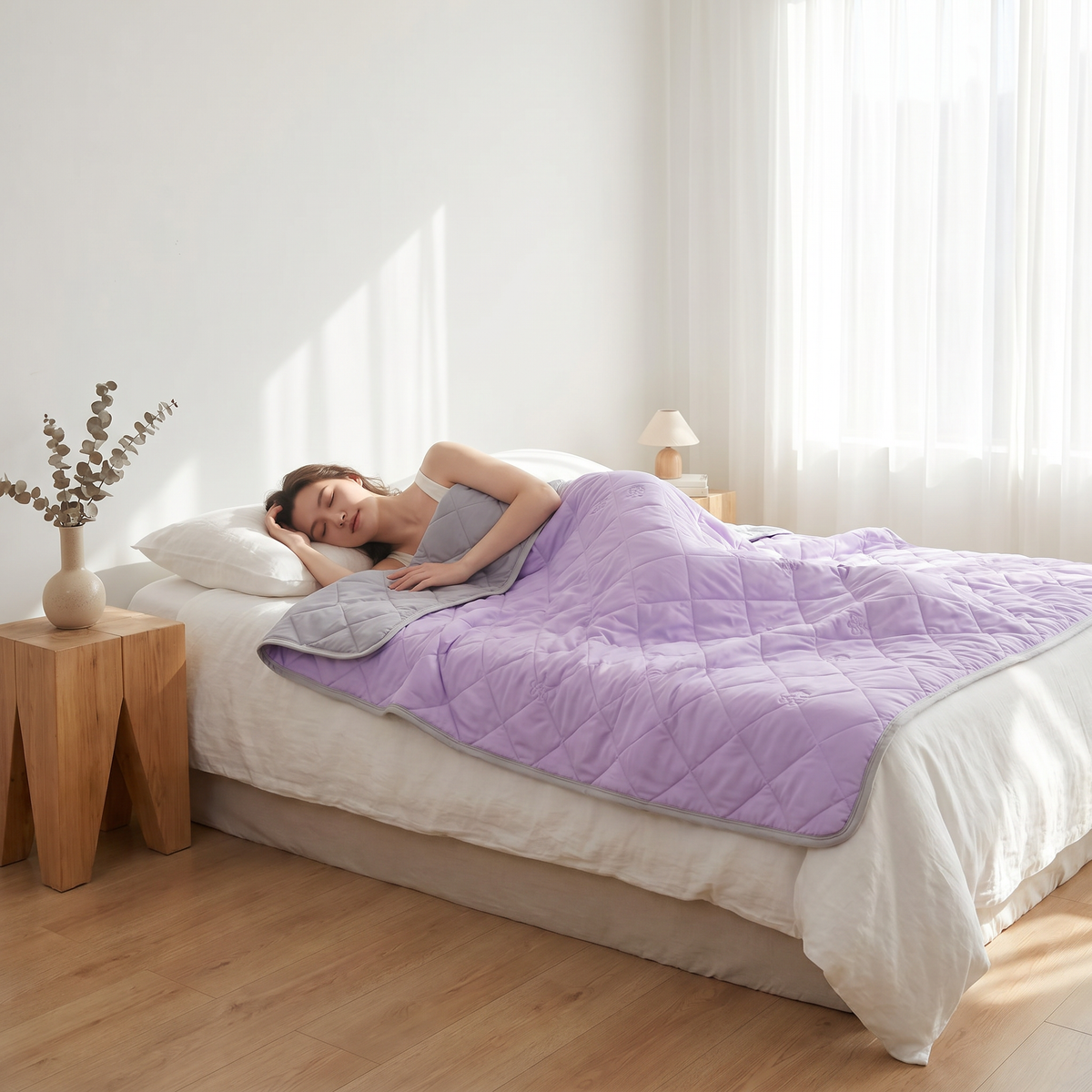 Person sleeping cool under the Puralo cooling blanket
